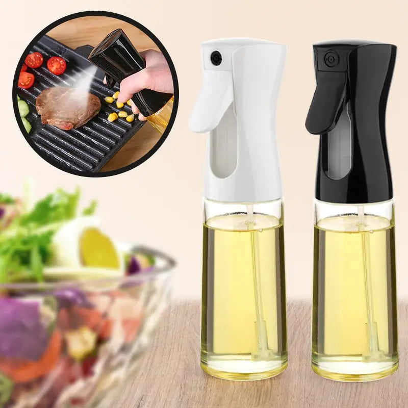 Two oil sprayers with a close-up of cooking and salad in the background