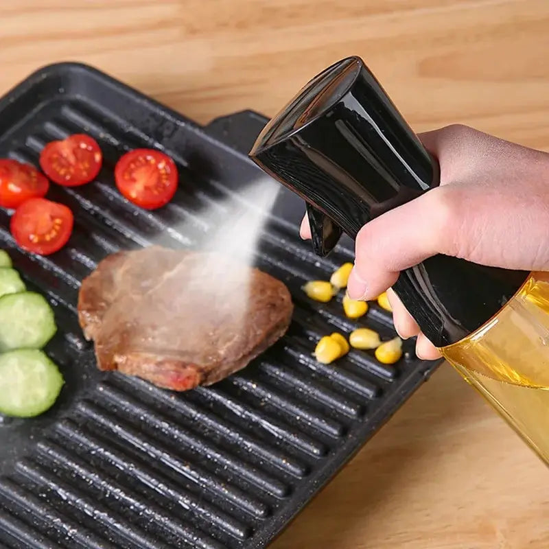 "Person pouring oil from a bottle onto a hot grill filled with vegetables and a steak, enhancing flavor and preventing sticking."