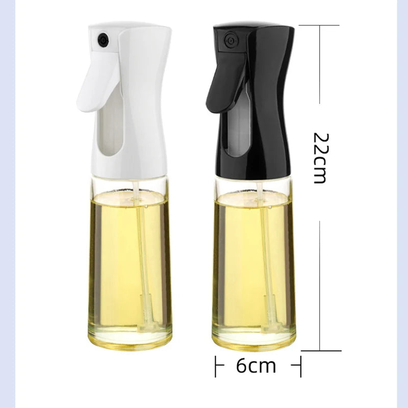 "Two glass spray bottles with black and white nozzles, filled with yellow liquid, displayed on a light blue background."