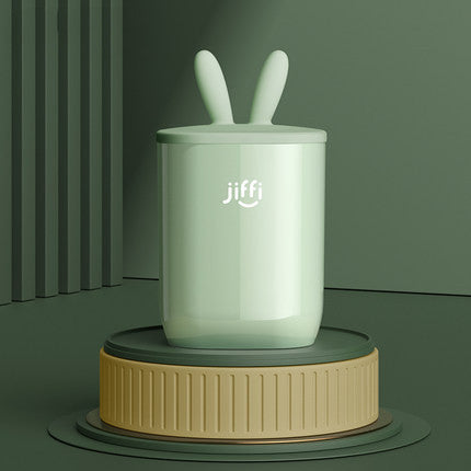 
"Cute decorative night light with rabbit ears, displayed on a soft green background, perfect for children’s bedrooms or nurseries."