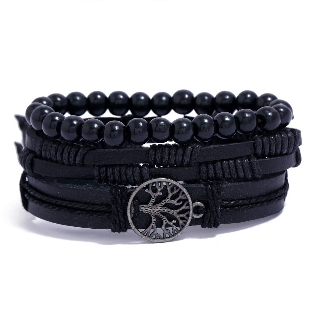 
Black beaded bracelet with leather straps and Tree of Life charm on white background – unisex spiritual accessory

