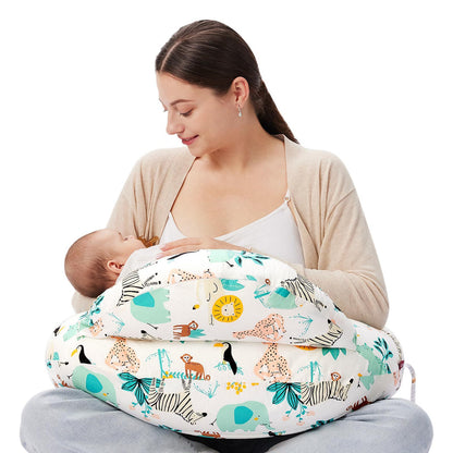
"Mother seated on the floor using a multifunctional nursing pillow to comfortably cradle her baby for breastfeeding support."