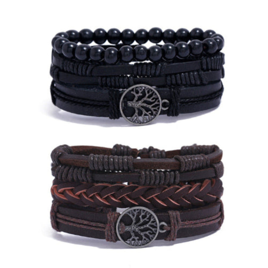 
Two braided leather bracelets in black and brown with Tree of Life charm on white background – unisex spiritual accessory
